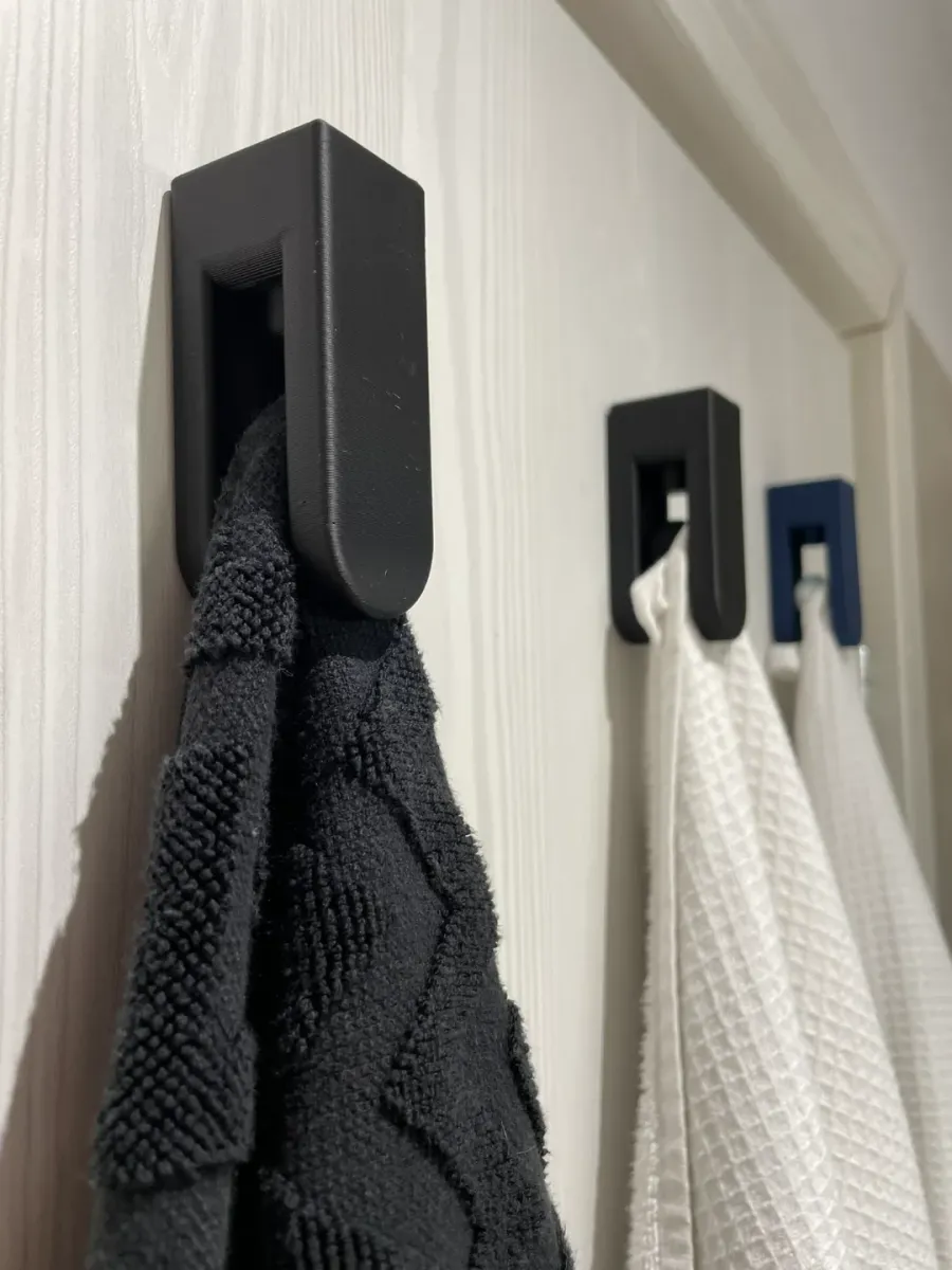 Percha con traba automática por peso