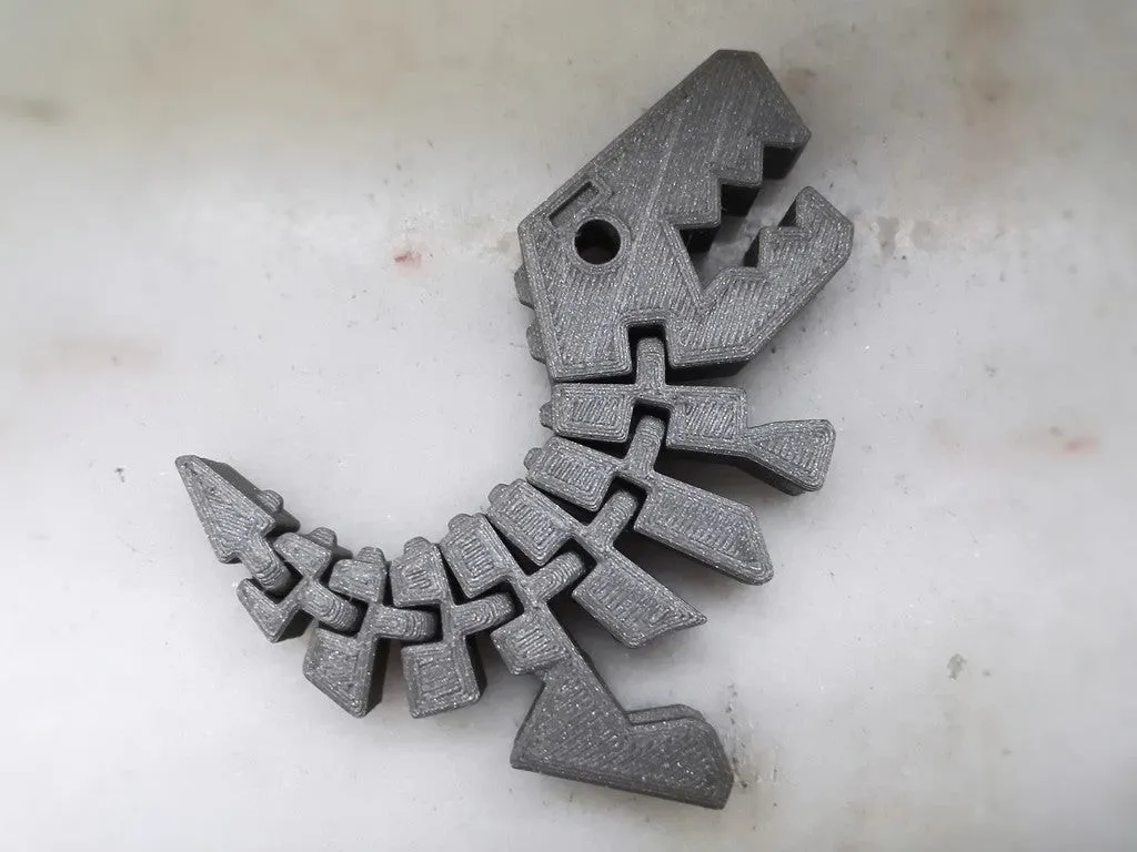 Dinosaurio articulado con eslabones reforzados