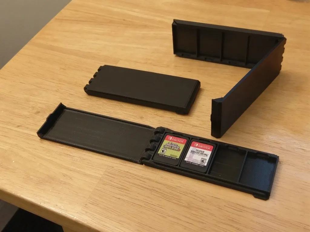 Estuche con tapa para cuatro cartuchos de juegos