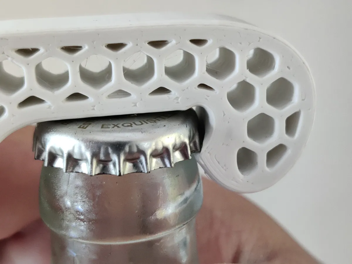 Abridor hexagonal de tapas para una mano