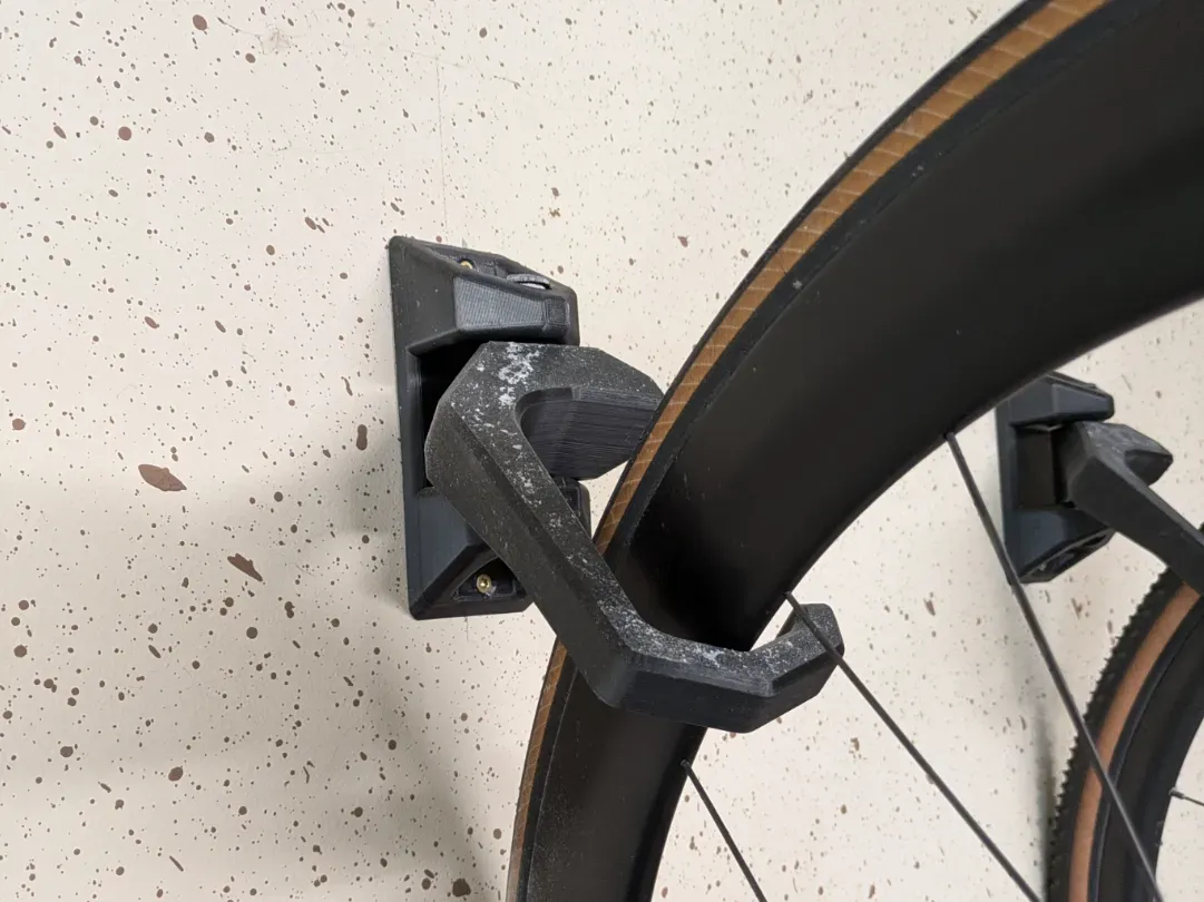Gancho giratorio de pared para bicicleta
