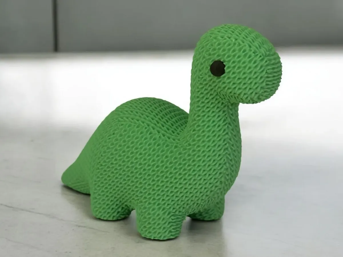 Dinosaurio chico con textura de tejido