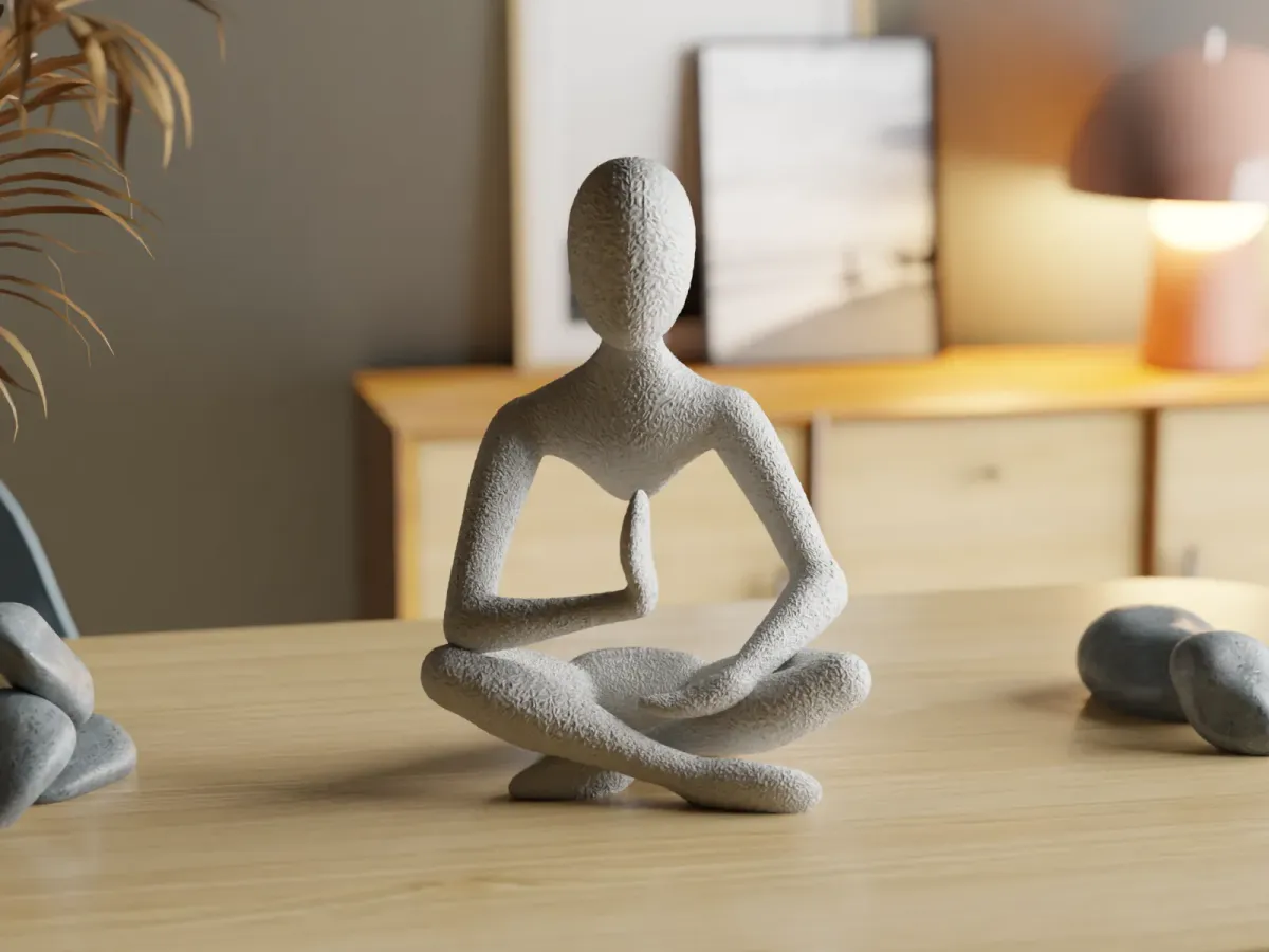 Escultura de figura meditando en el aire