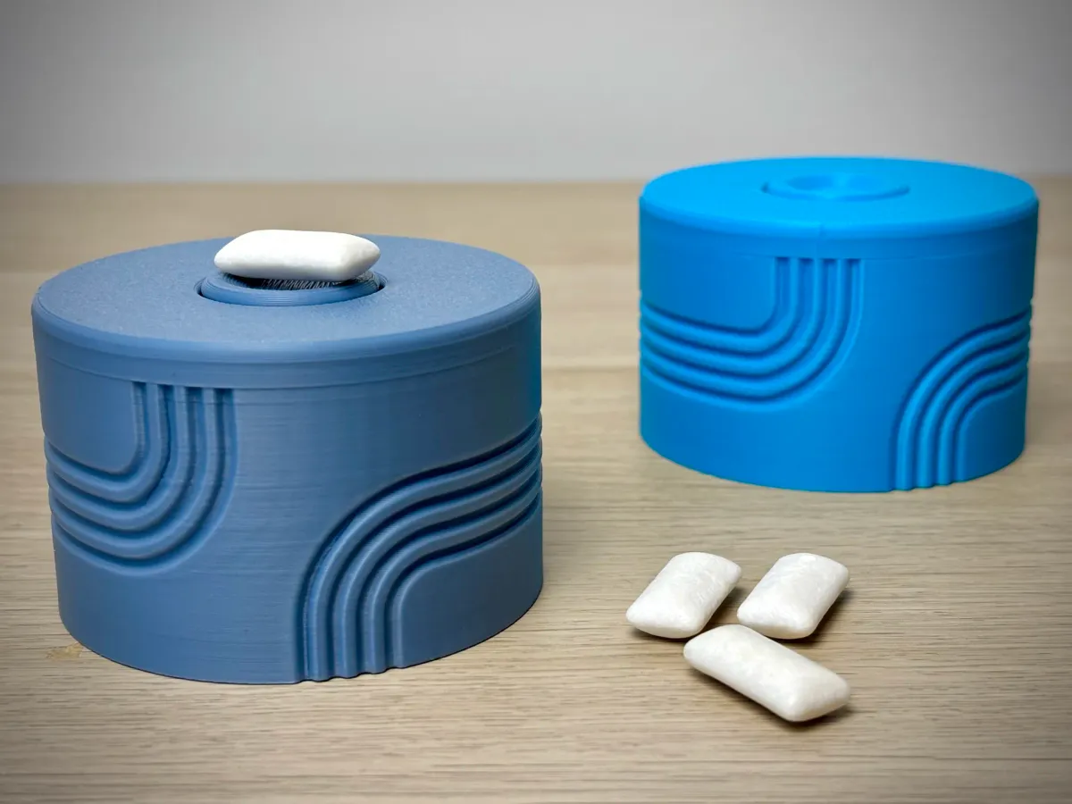 Dispensador de chicles con tapa giratoria