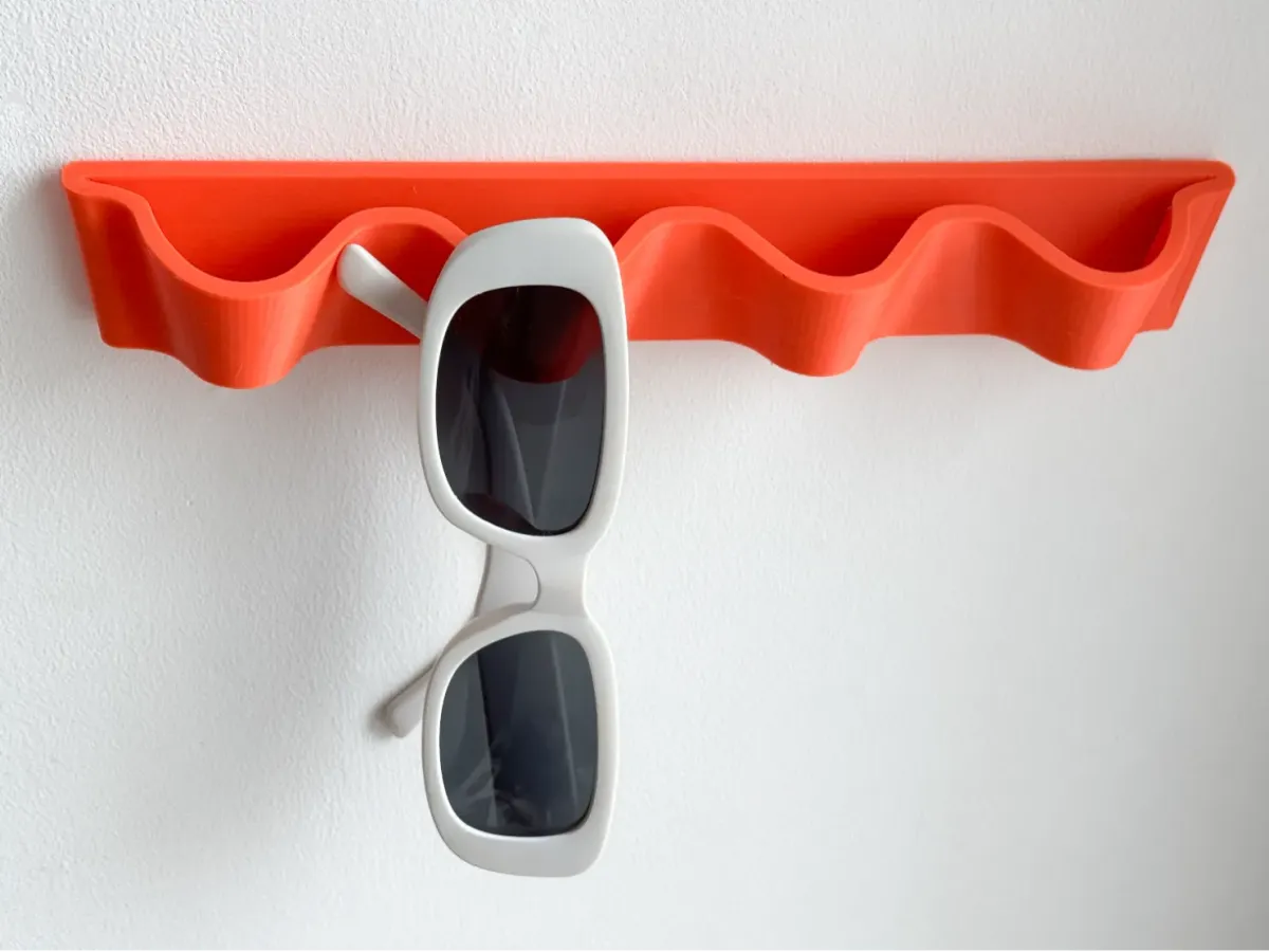 Percha con forma de ola para anteojos