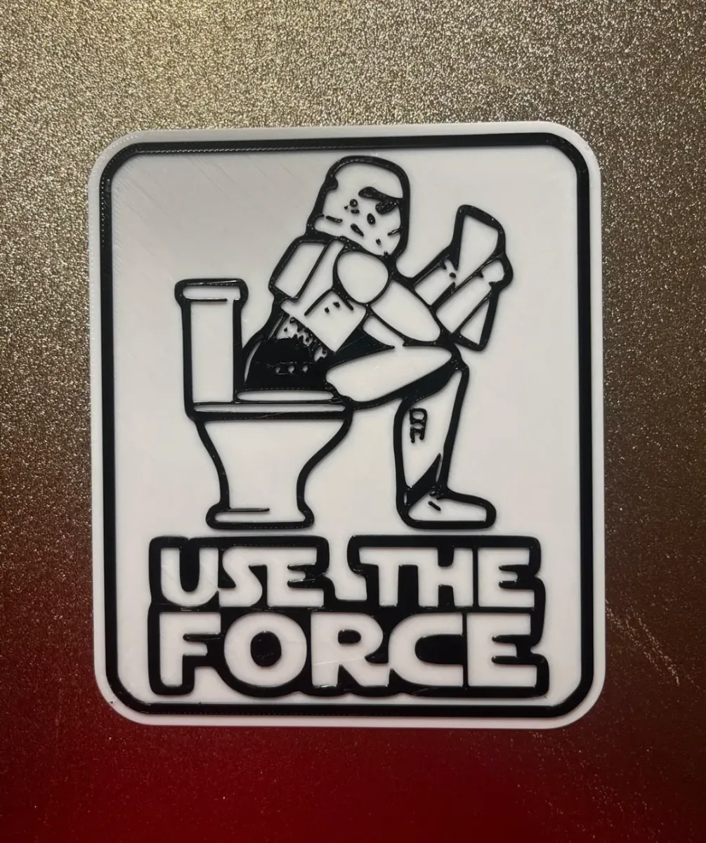 Señal de baño con siluetas de ciencia ficción