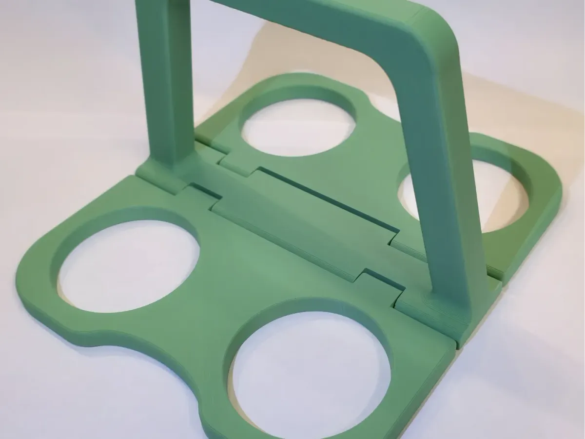 Portavasos plegable para cuatro cafés con manija