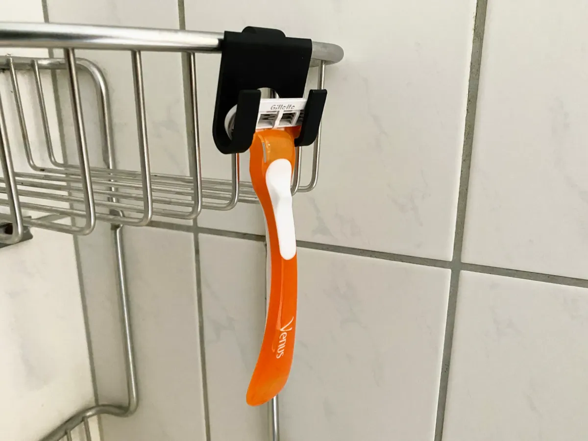 Soporte de afeitadora para la ducha