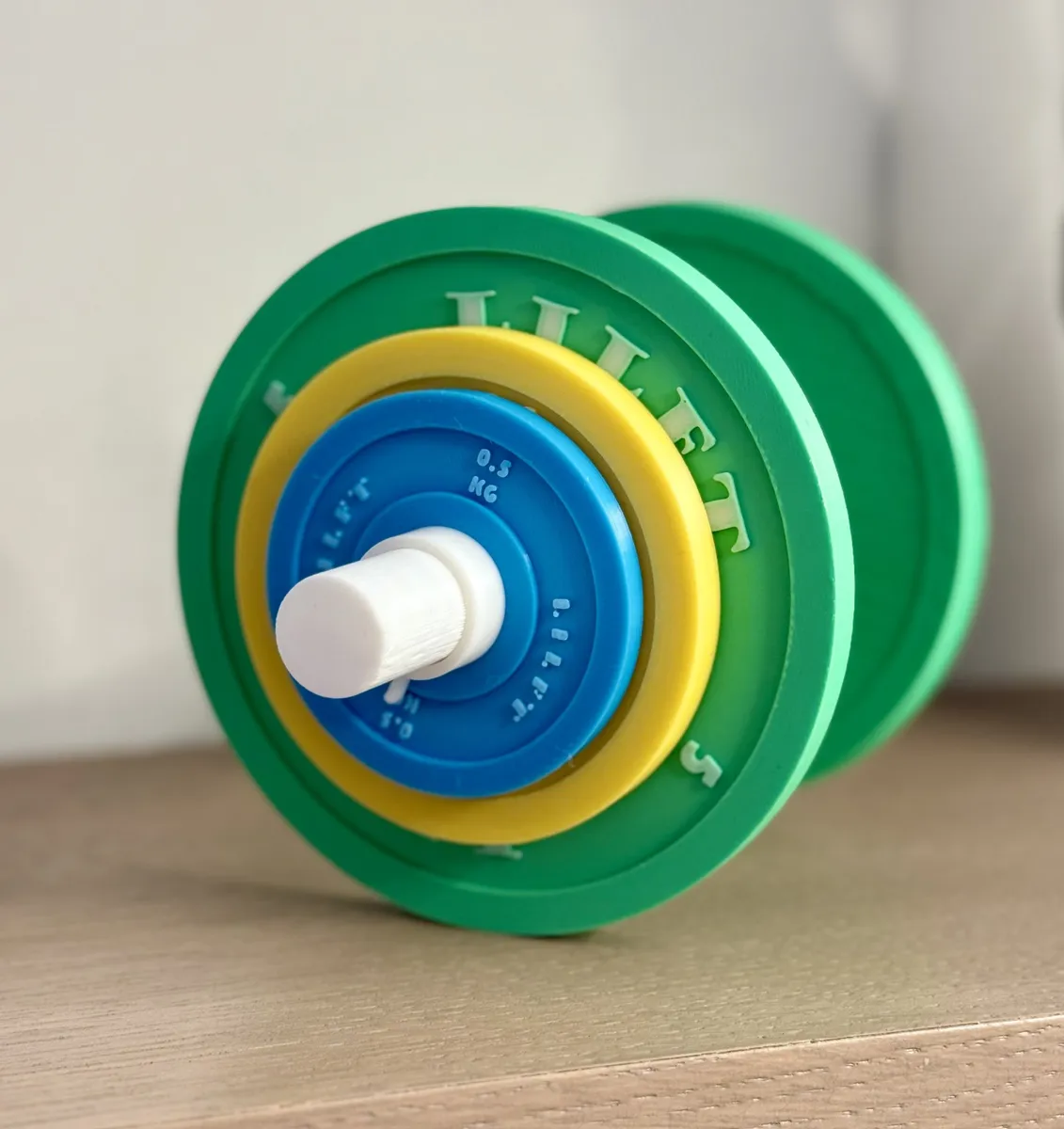 Mancuernita de juguete con discos