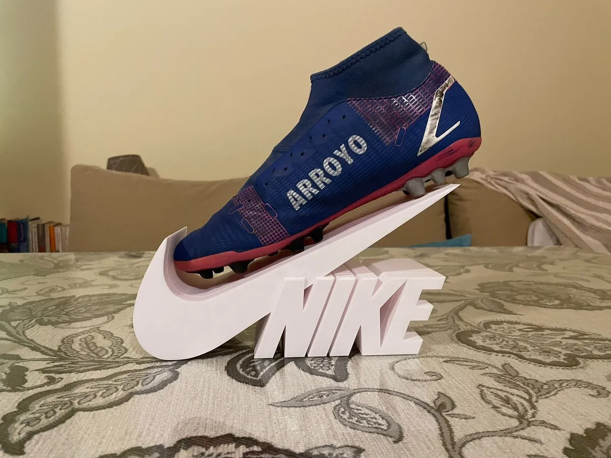 Exhibidor de zapatilla para vidriera