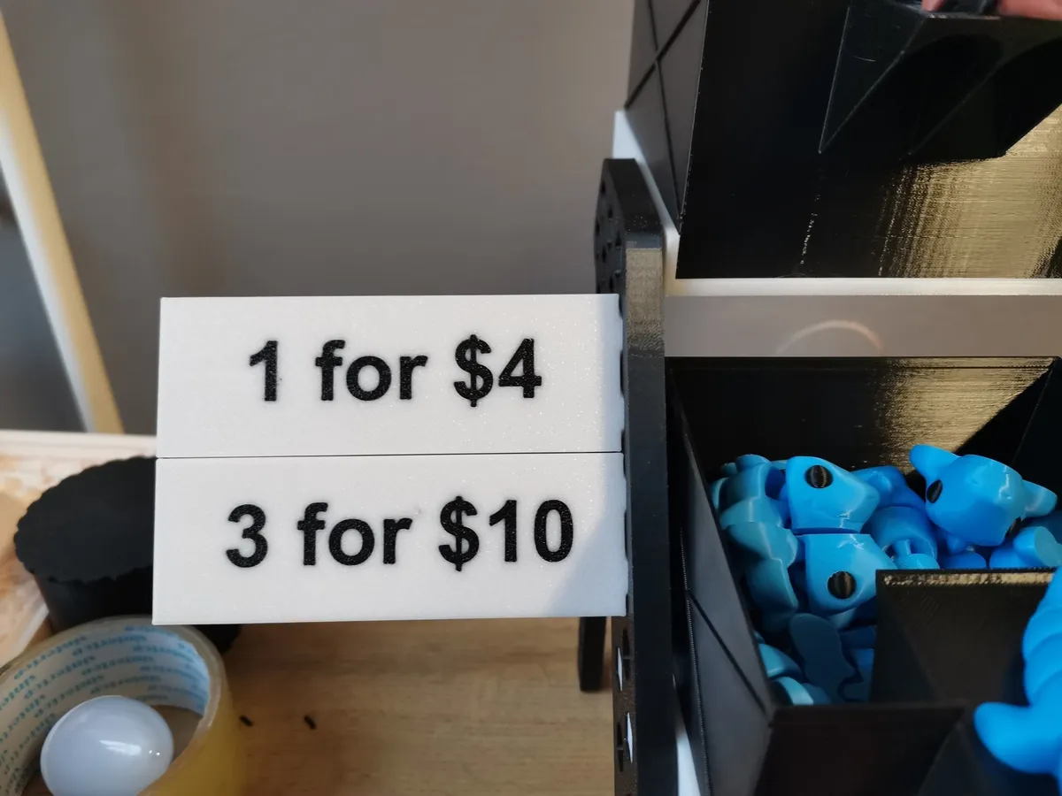 Portaprecio que se engancha al estante