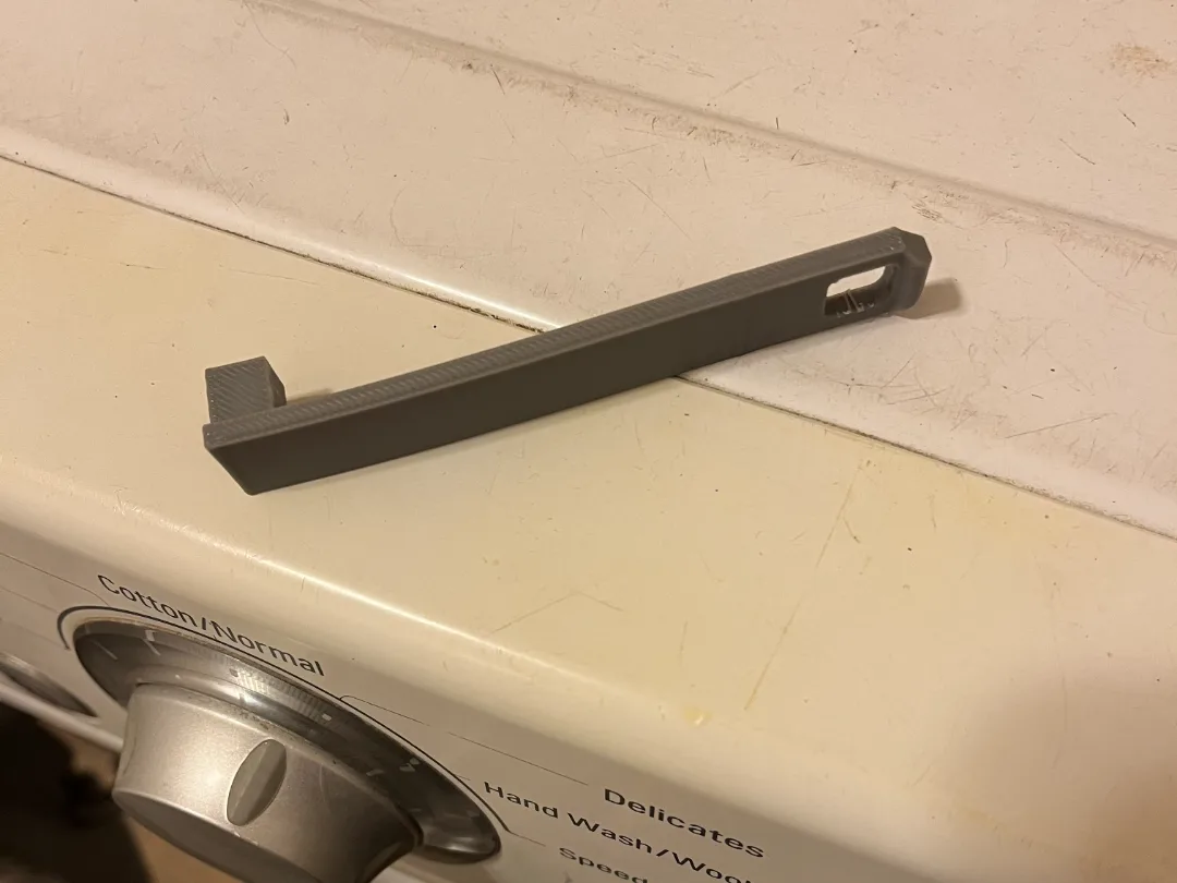 Traba para la puerta del lavarropas