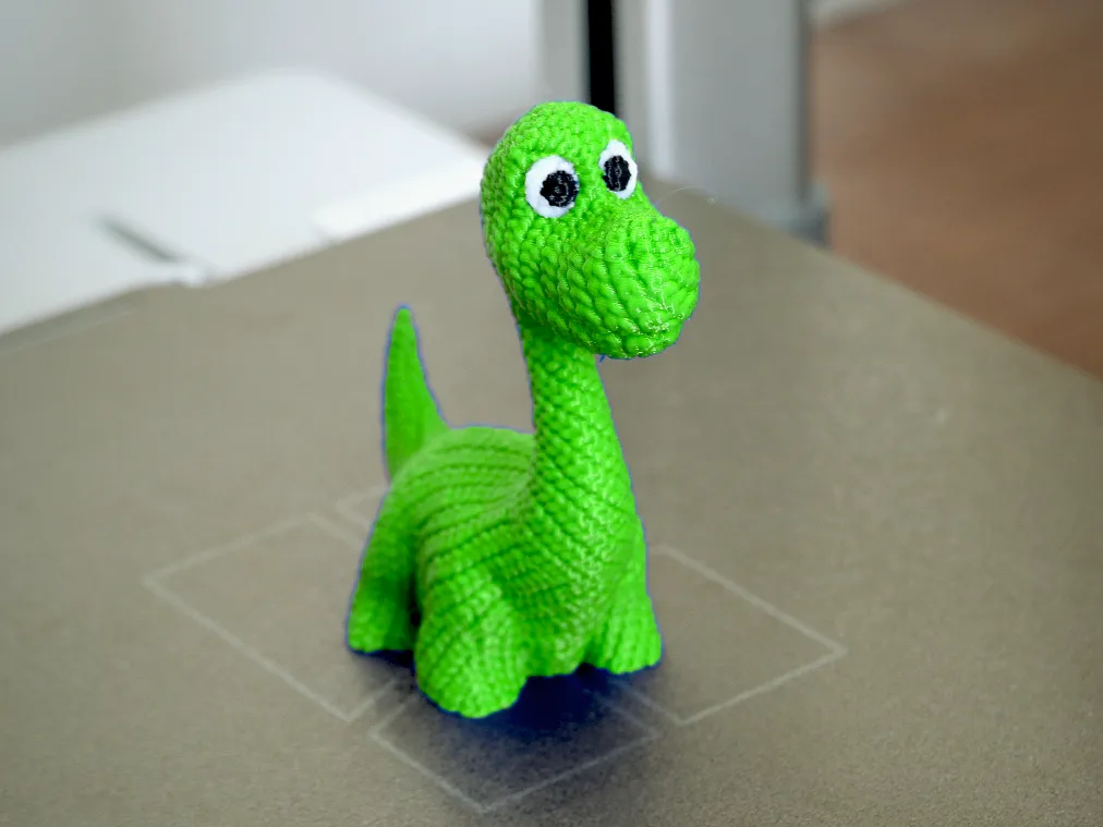 Dinosaurio tejido de adorno