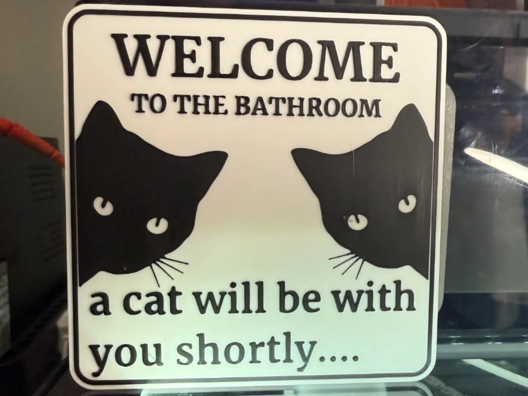 Cartel de baño con gato