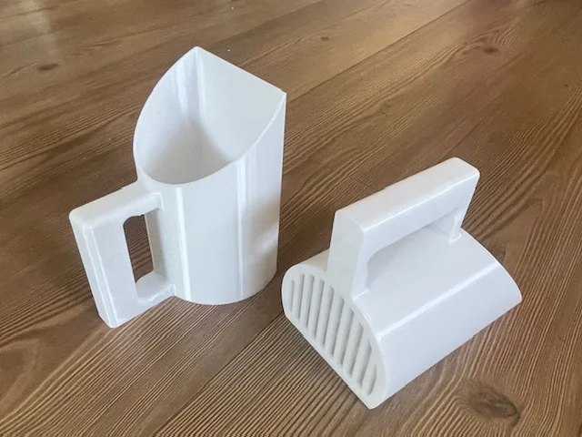 Pala para arena de gato y alimento