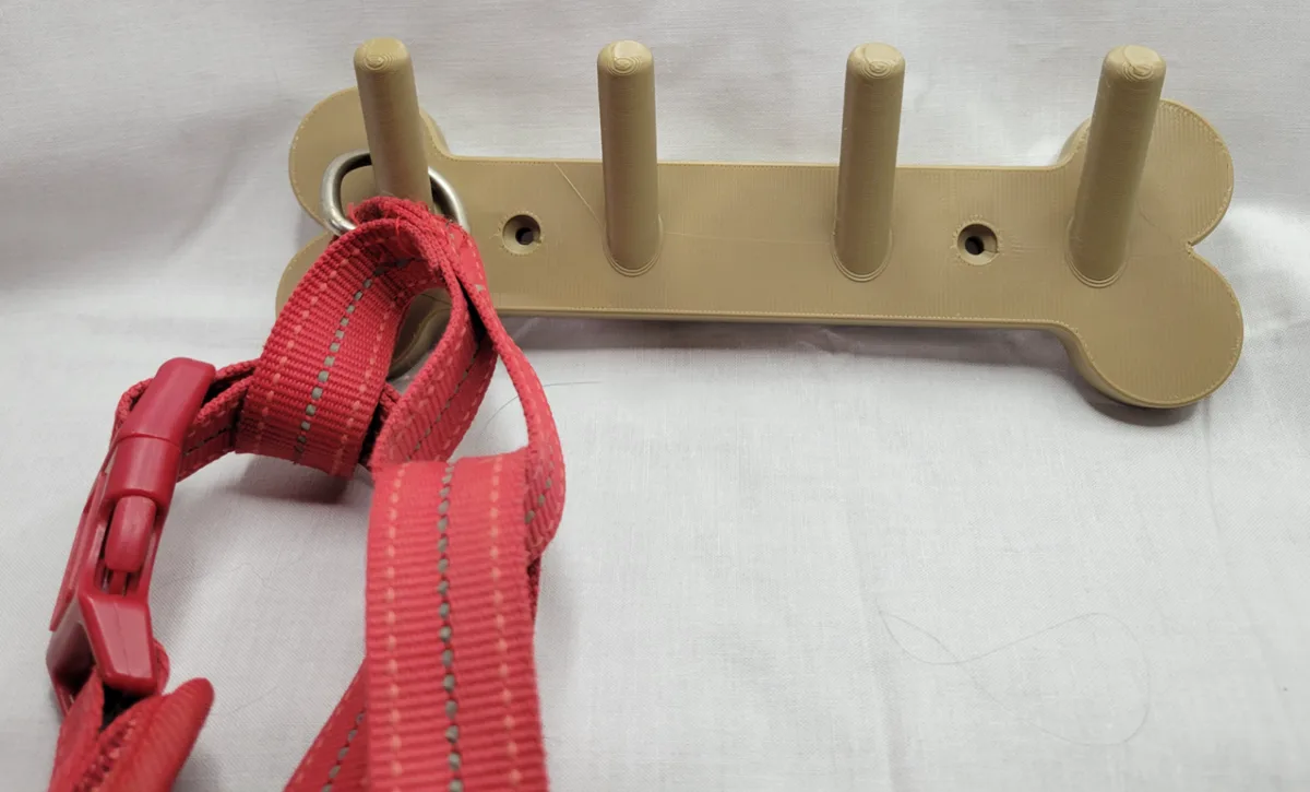 Colgador de correa con forma de hueso