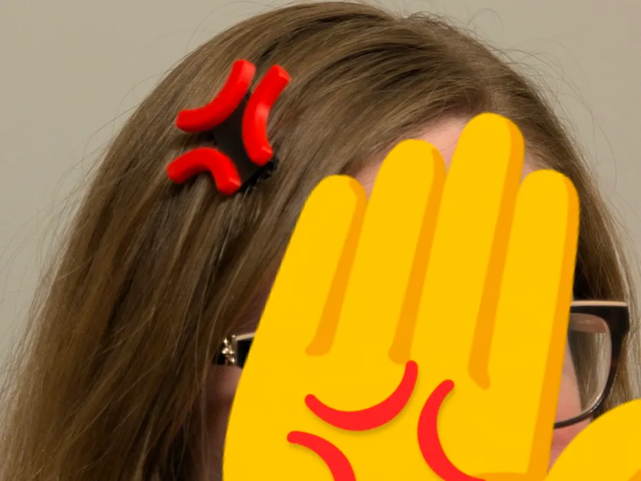 Hebilla de pelo con símbolo de enojo