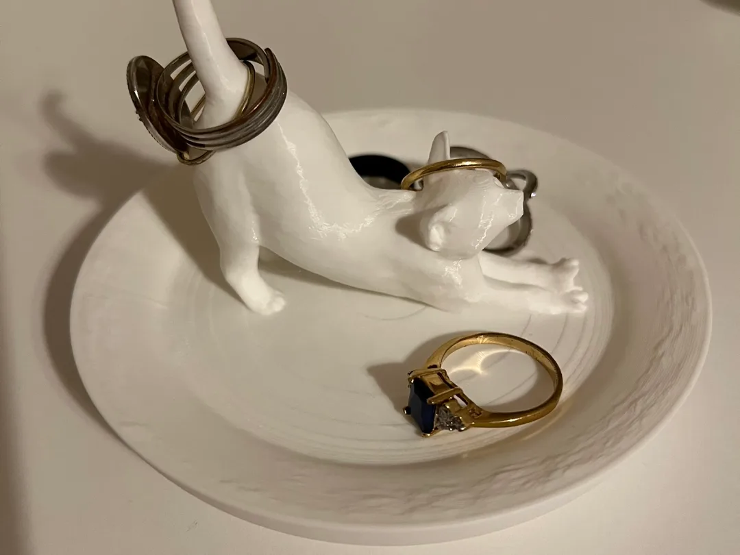 Portanillos con forma de gato estirándose