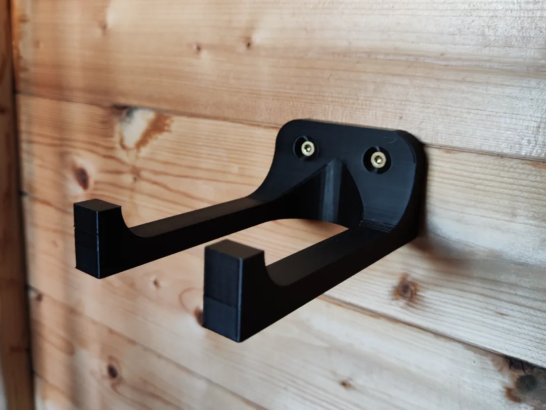Soporte de pared para dos herramientas de jardín