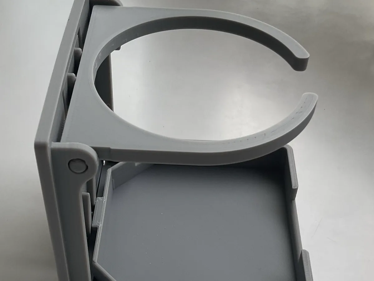 Portavaso plegable de pared