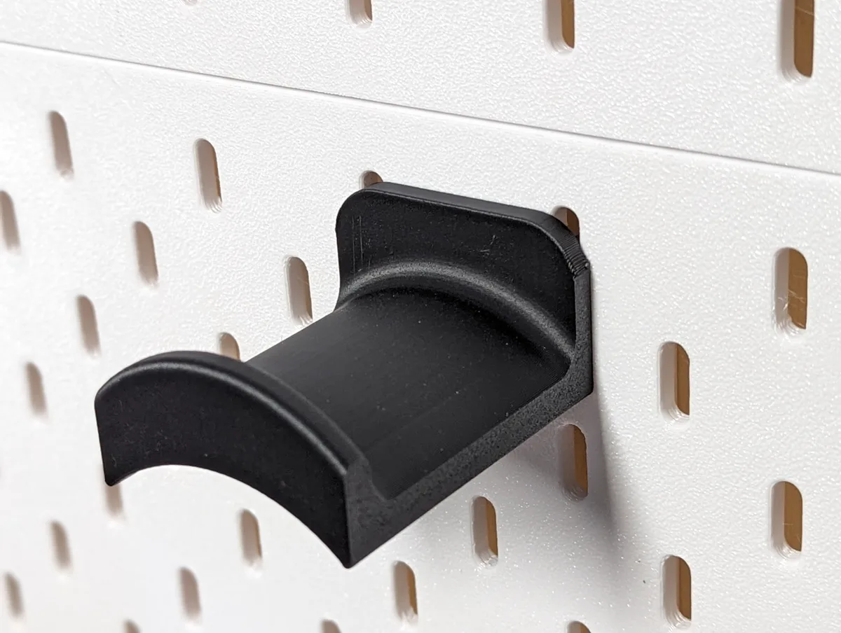 Soporte de auriculares para panel perforado
