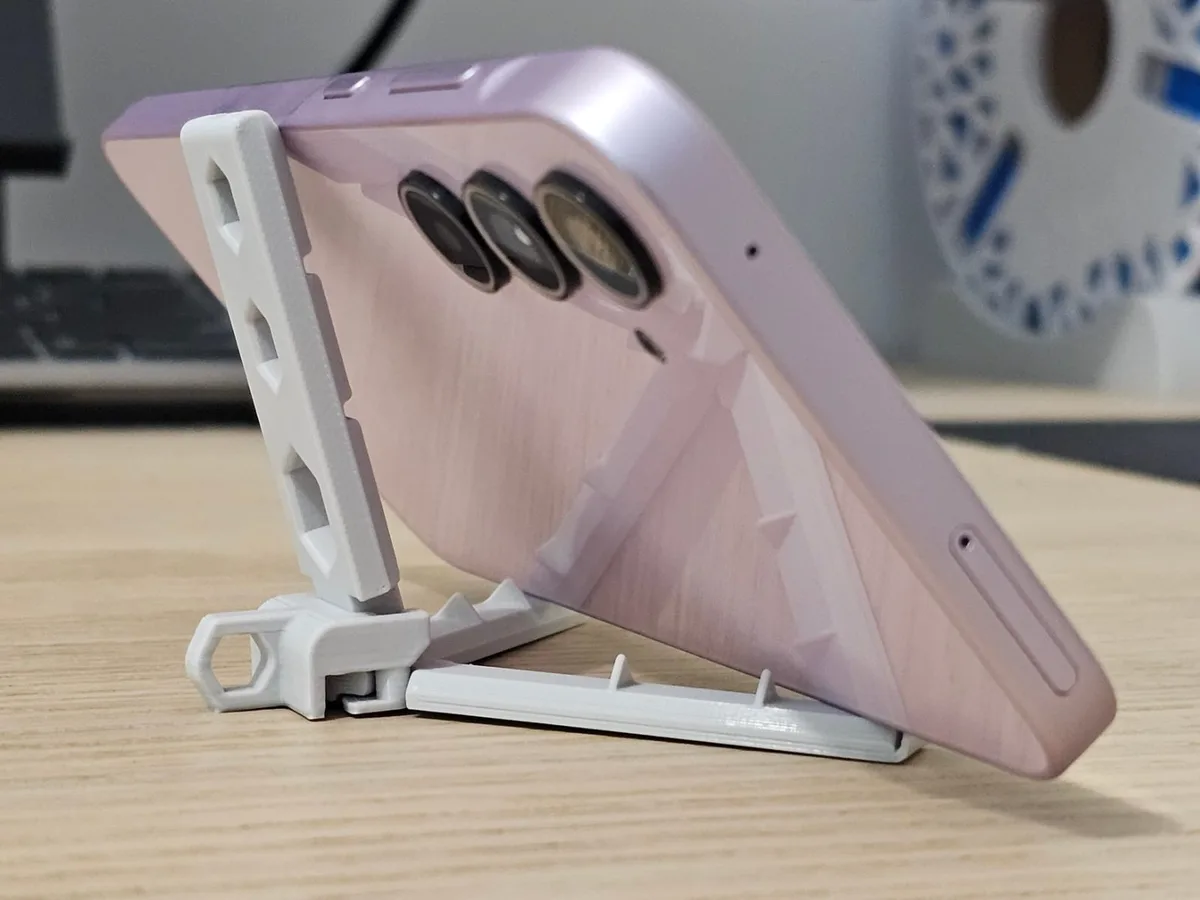 Soporte de celular con brazos automáticos
