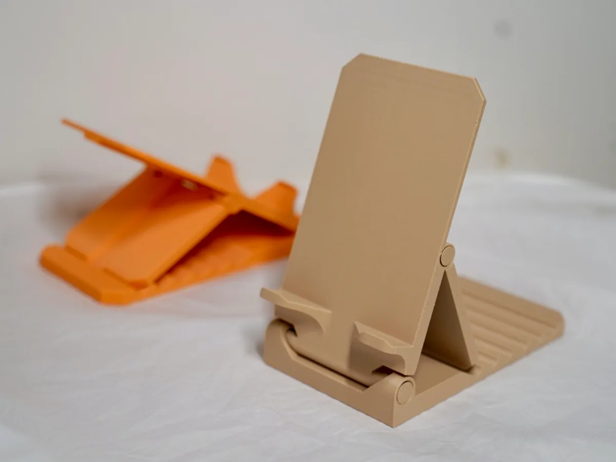 Soporte de celular plegable de una sola pieza