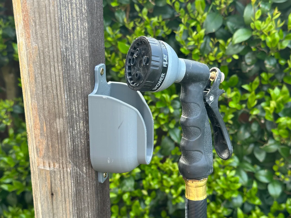 Soporte de pared para la pistola de manguera