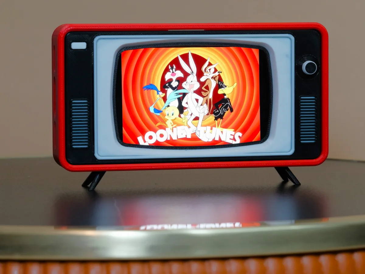 Soporte de celular con forma de televisor antiguo