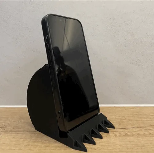 Soporte de celular con forma de balde de excavadora