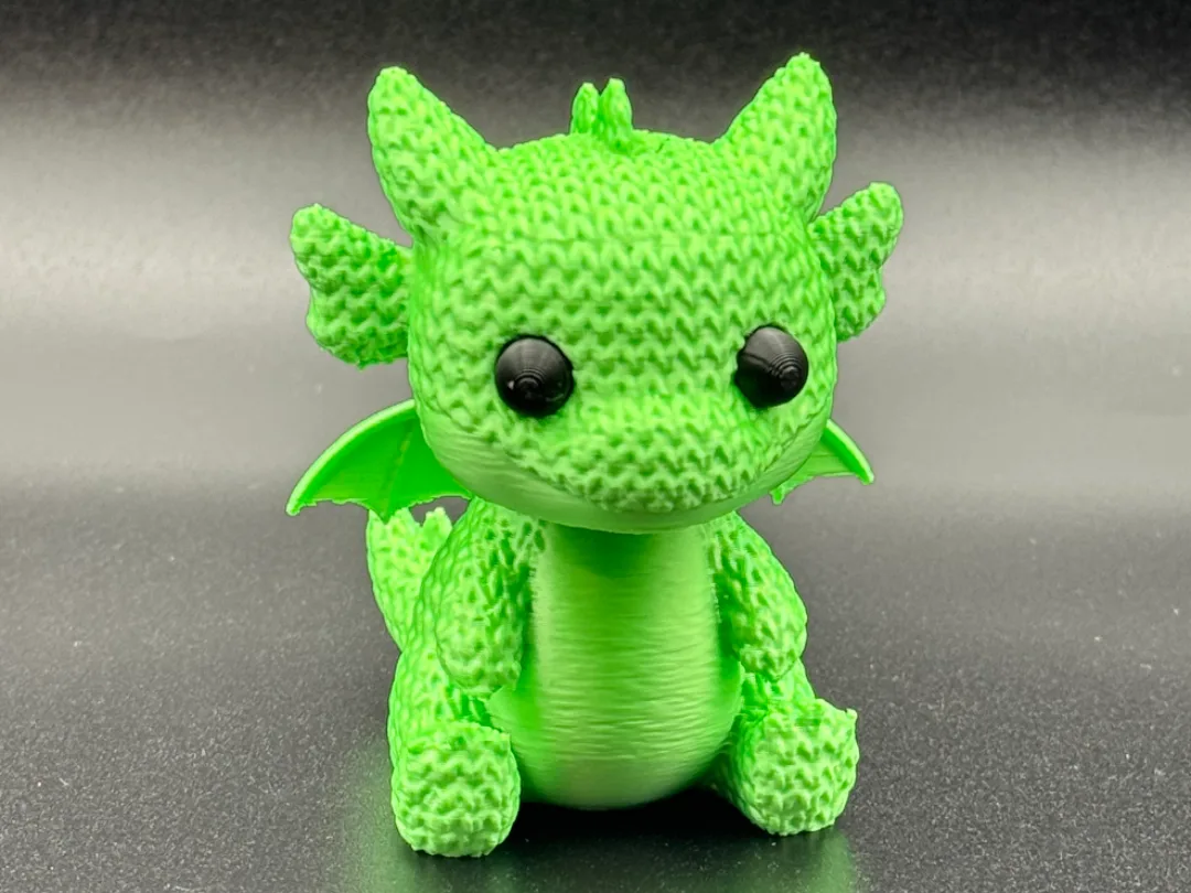 Cría de dragón con textura de tejido